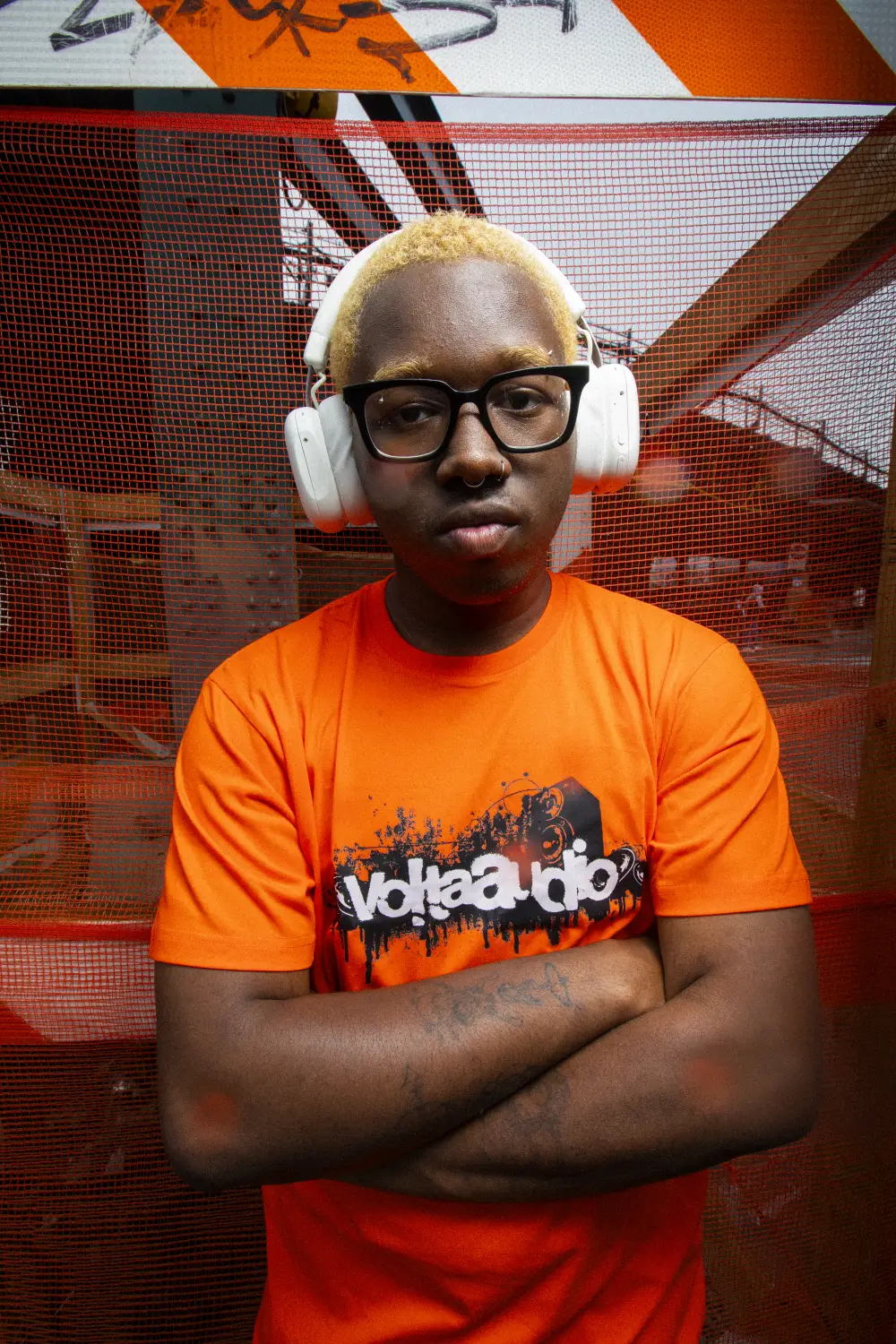 Person wearing white Volta Audio headphones in New York City