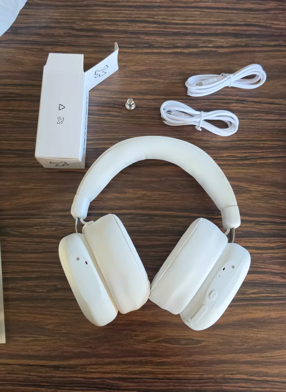 A white Volta unboxed with its cables and accessories